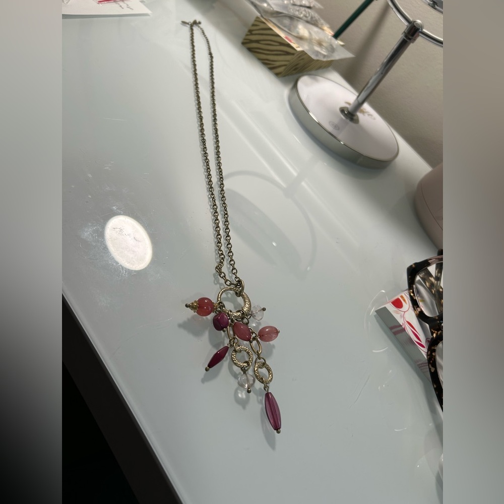 Li Sophia Matte Gold Necklace with pink/burgundy tone stones.